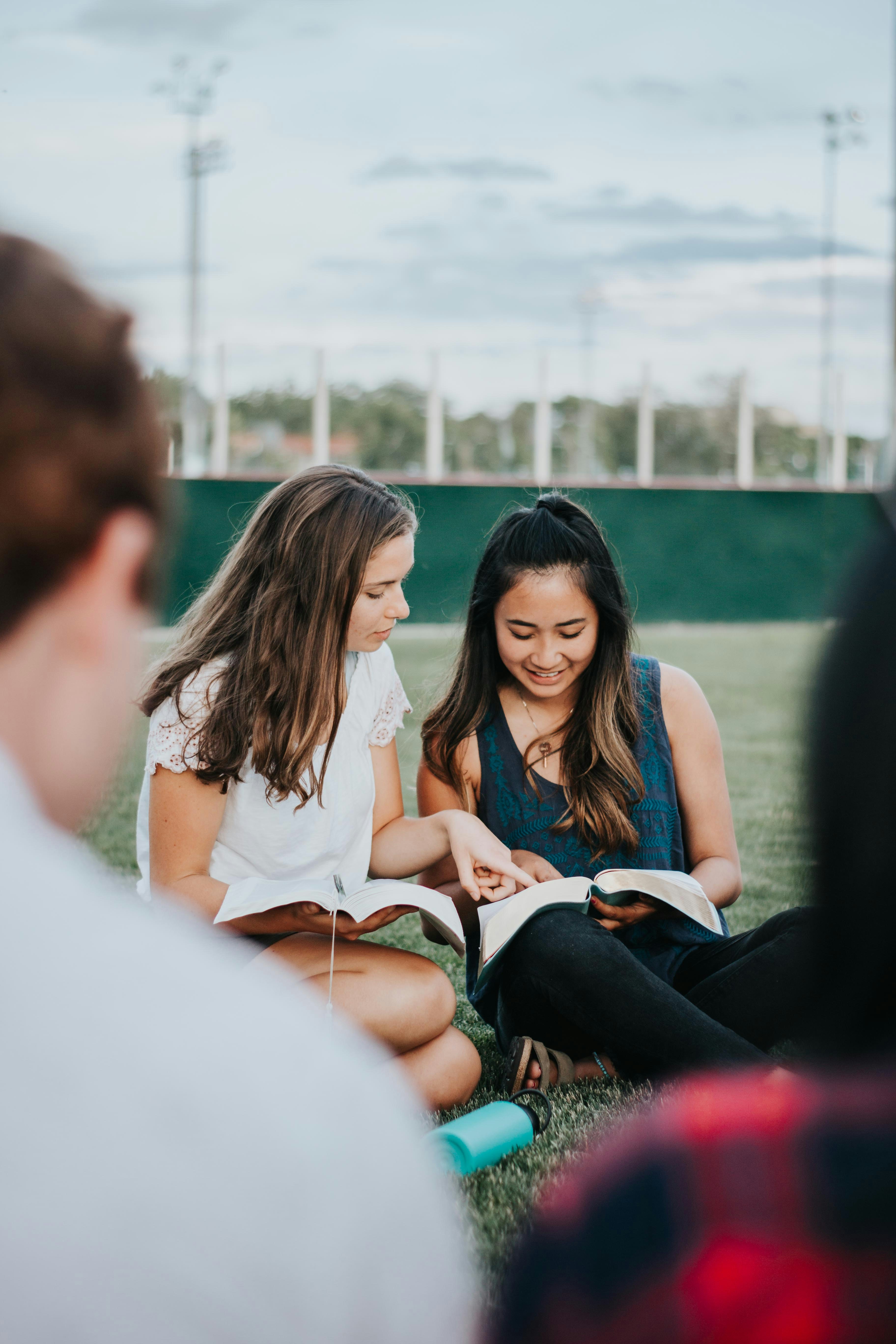 2 students studying the Bible